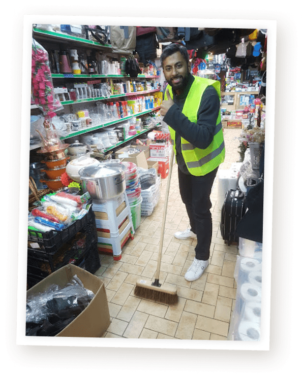 Portrait of Adeel Chowdhry in his early days, humbly working as a janitor and pushing a broom, representing his journey from modest beginnings to becoming a successful online entrepreneur and creator of the Internet Millionaire program.