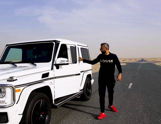 Adeel Chowdhry in Boss tee shirt stepping out of G-Wagon in Dubai