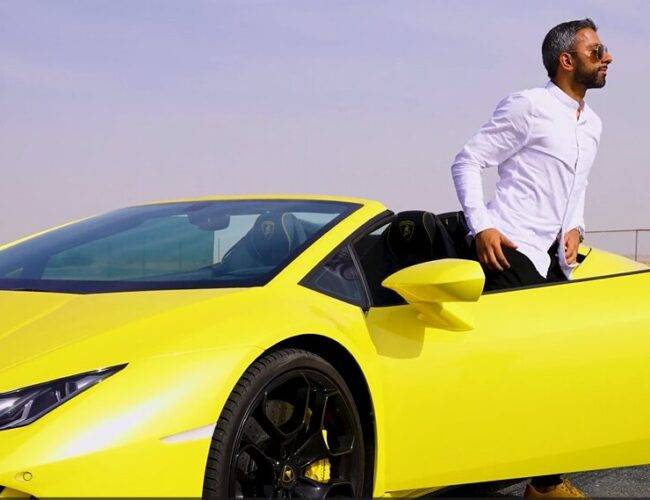 Adeel Chowdhry stepping out of yellow Lamborghini
