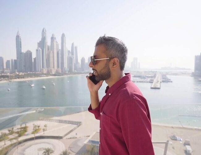 Adeel Chowdhry taking a call from his balcony in Dubai Penthouse
